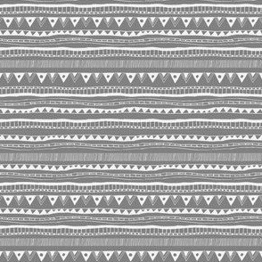 Tribal seamless pattern - chalk tribal signs on gray background