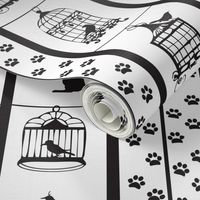 Black and white birdcage and cat