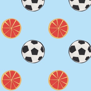 soccer balls and oranges | baby blue background