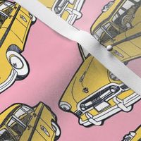 Fifties Checker taxi cab, yellow on pink