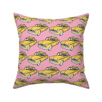 Fifties Checker taxi cab, yellow on pink