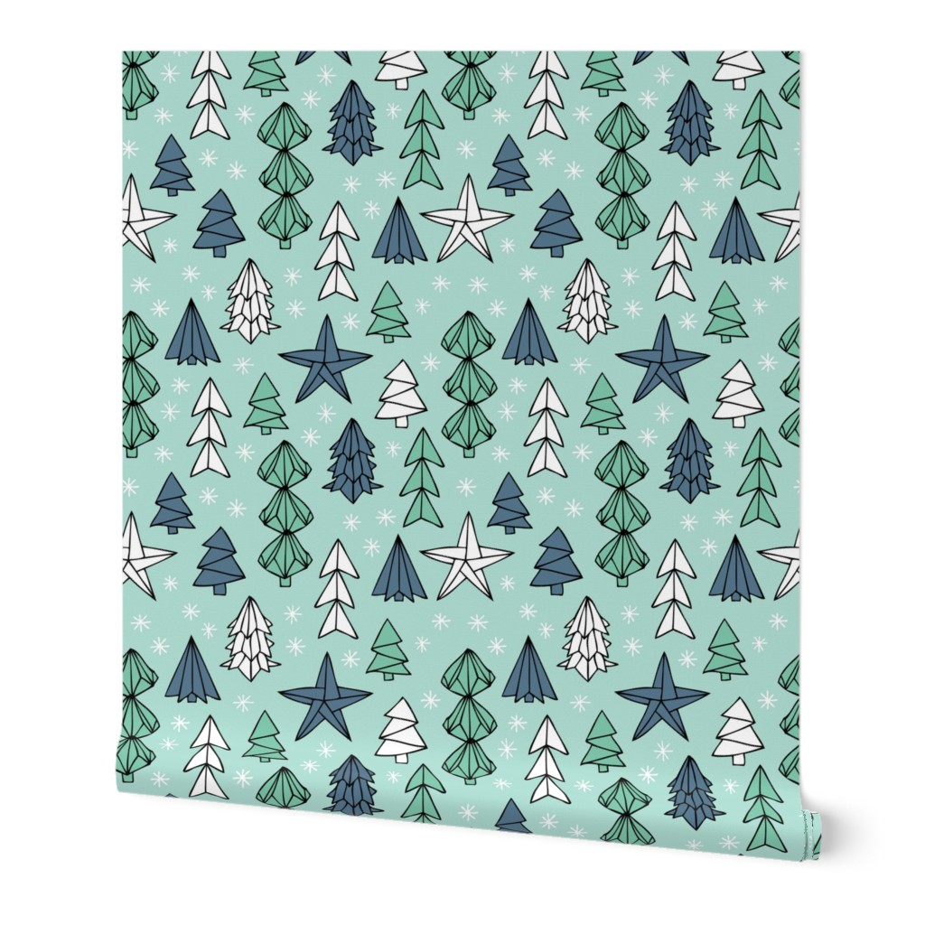 Christmas trees and origami decoration stars seasonal geometric december holiday design mint blue