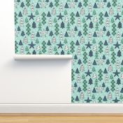 Christmas trees and origami decoration stars seasonal geometric december holiday design mint blue