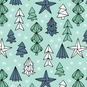 Christmas trees and origami decoration stars seasonal geometric december holiday design mint blue