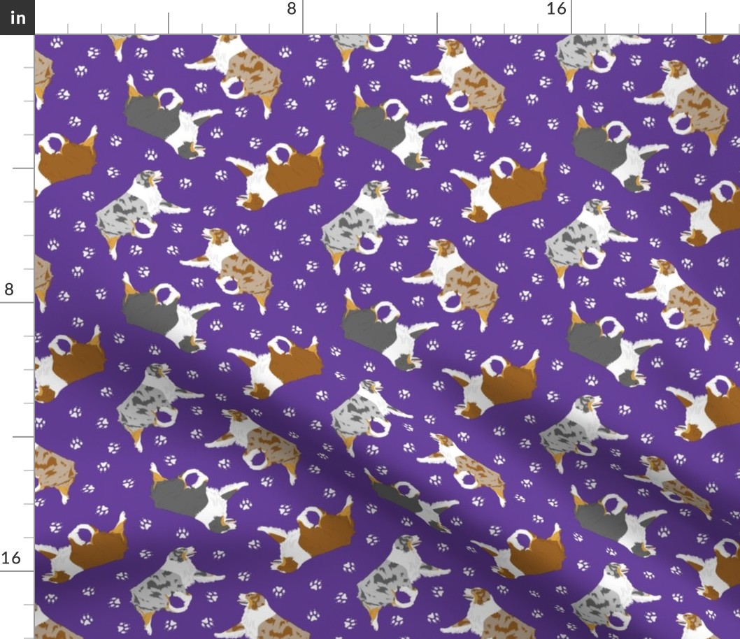 Small trotting Australian Shepherds and paw prints - dark purple