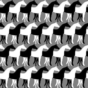 Two Inch Black and White Overlapping Horses on Medium Gray