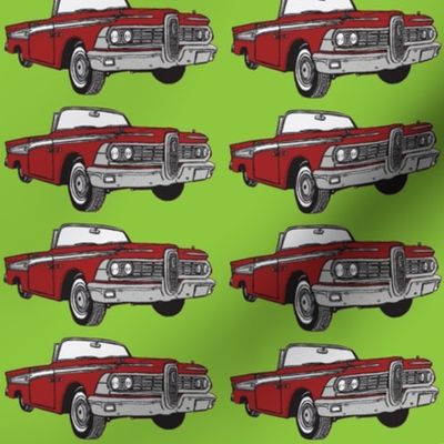 Giant 1959 red Edsel Corsair convertible on green background