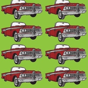 Giant 1959 red Edsel Corsair convertible on green background