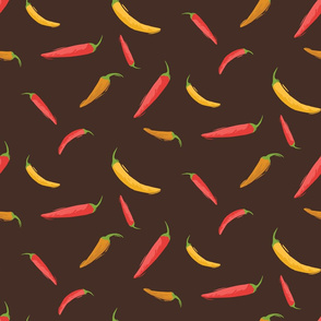 Red, yellow, and orange hot chili peppers in brown