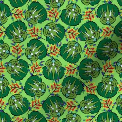 Scattered Triceratops Faces with Rainbow Leaves on Green