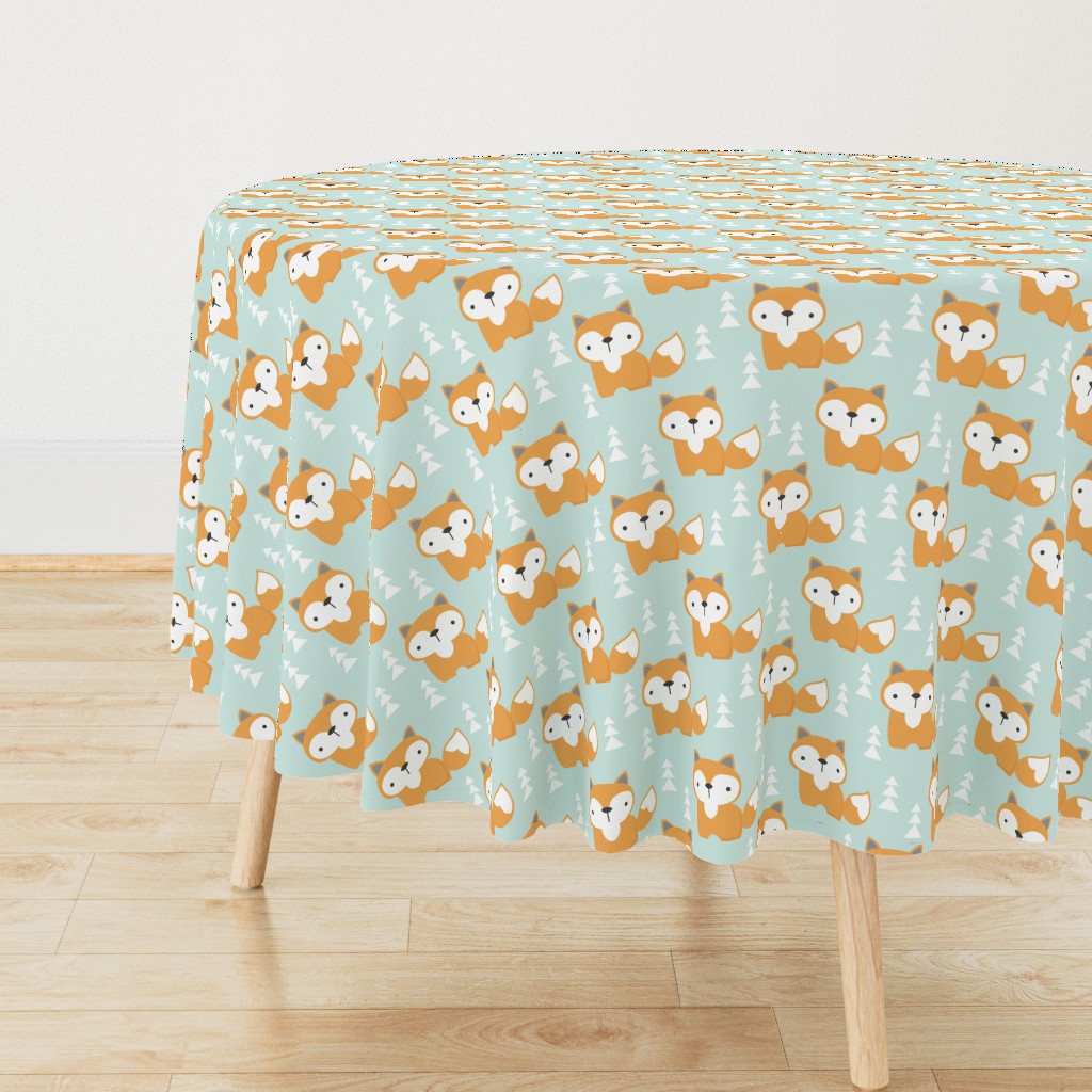 foxes on soft turquoise