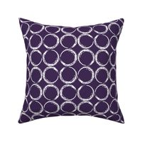 Circles in a geometric pattern on purple background