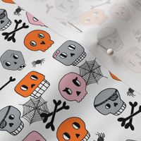 skulls // pink orange halloween spider bones spider webs 