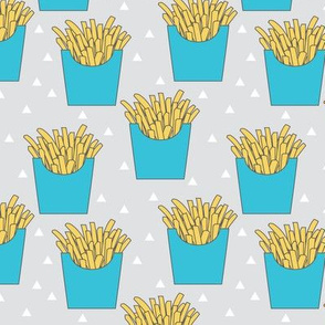 french-fries-with-blue-box-on-grey