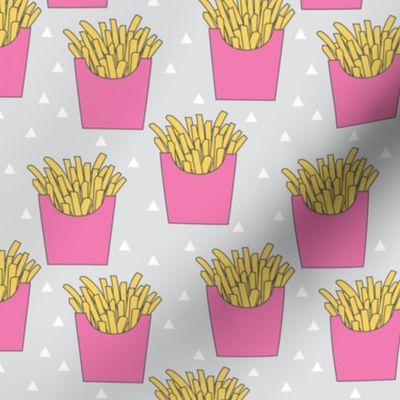 french-fries-with-pink-box-on-grey