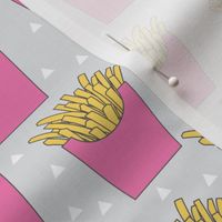 french-fries-with-pink-box-on-grey