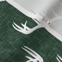 antlers on hunter green linen