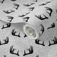 black antlers on light grey linen 