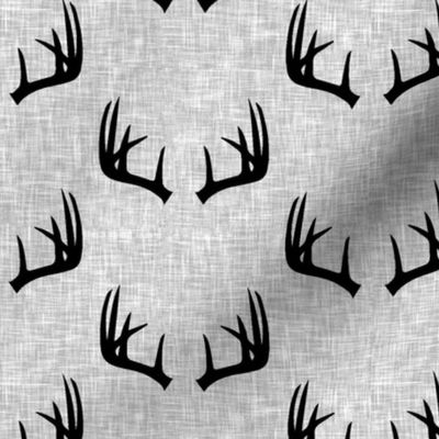 black antlers on light grey linen 