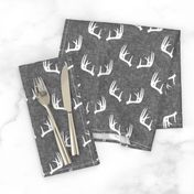 antlers on grey linen