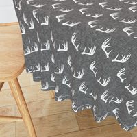 antlers on grey linen