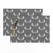 antlers on grey linen