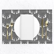 antlers on grey linen