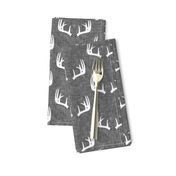 antlers on grey linen