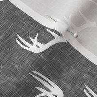 antlers on grey linen