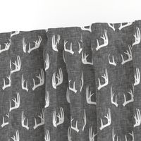 antlers on grey linen