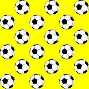 One Inch Black and White Soccer Balls on Yellow