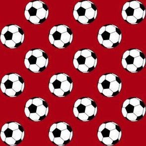 One Inch Black and White Soccer Balls on Dark Red