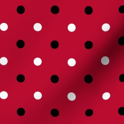 Red and black team color polka dot red background