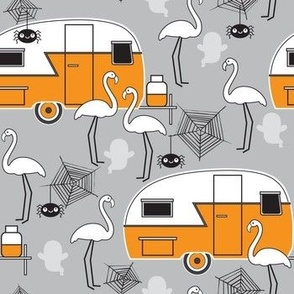 Halloween trailers and flamingos on grey