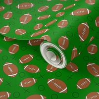 footballs on green