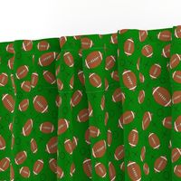 footballs on green