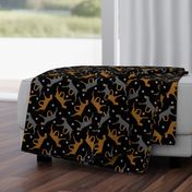 Trotting Doberman Pinschers and paw prints - black