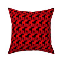 Two Inch Black and Red Overlapping Horses on Dark Red