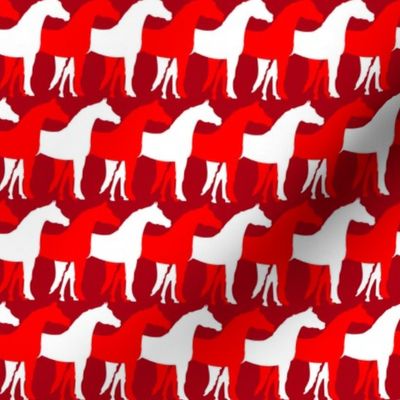 Two Inch White and Red Overlapping Horses on Dark Red