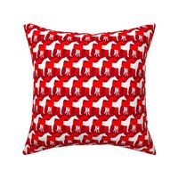 Two Inch White and Red Overlapping Horses on Dark Red