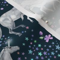 Mom and baby unicorns with stars on dark