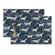 Mom and baby unicorns with stars on dark