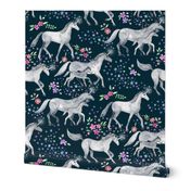 Mom and baby unicorns with stars on dark