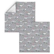 Mom and baby unicorns with stars on soft grey