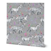 Mom and baby unicorns with stars on soft grey