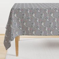 Mom and baby unicorns with stars on soft grey