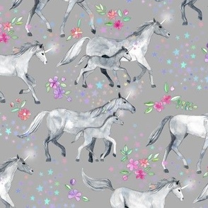 Mom and baby unicorns with stars on soft grey