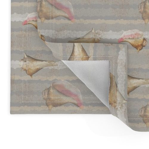 Conch Shells on Sandy Beige