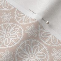 Lace pattern with white flowers on beige background