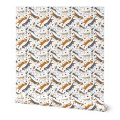 Trotting Basset hounds and paw prints - white